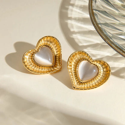 White cat eye stone earrings with niche temperament titanium steel earrings