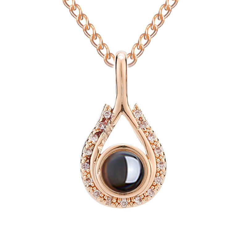 Waterdrop shaped fashion projection necklace with 100 languages. I love you. Color photos, customized lover accessories